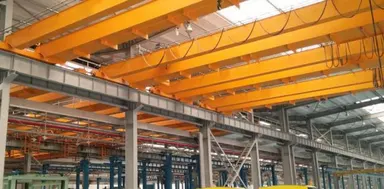 Overhead cranes running the length of an automotive assembly hall