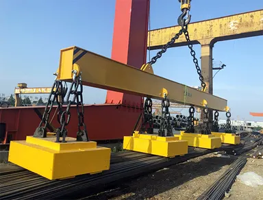 Test load suspended from a lifting beam during a crane load test
